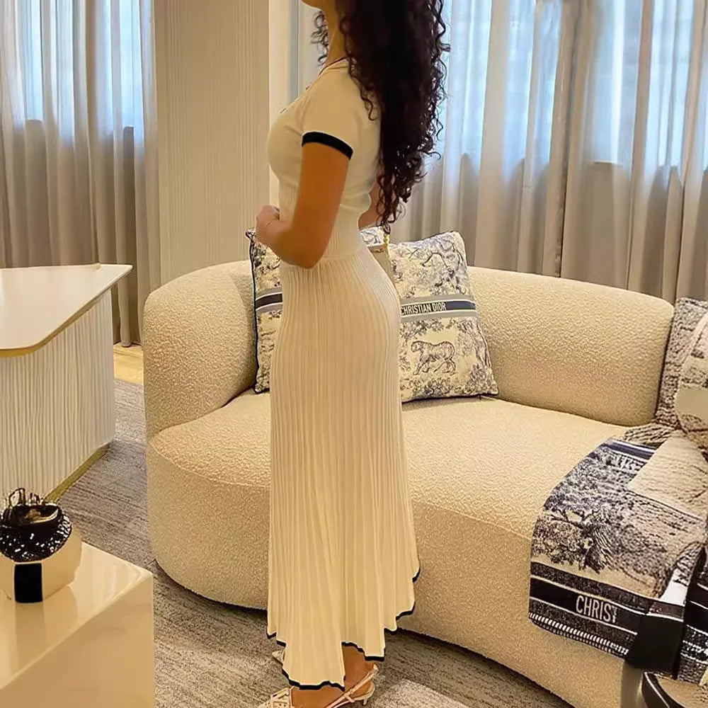 Elegant 2-Piece White Skirt Set – Crop Top & Pleated Midi Skirt